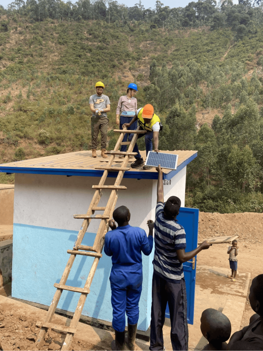 a group of men on a ladder on a roof