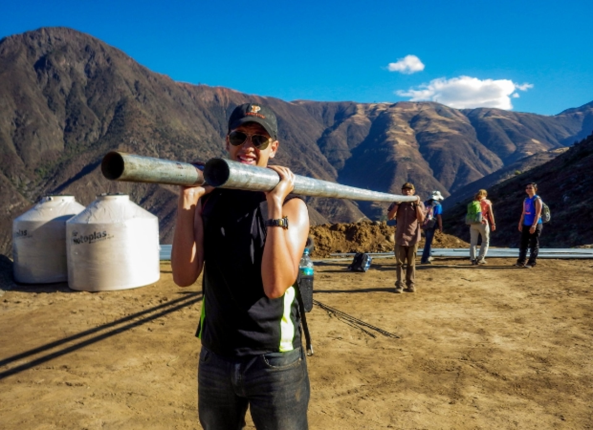 a person holding a metal pipe