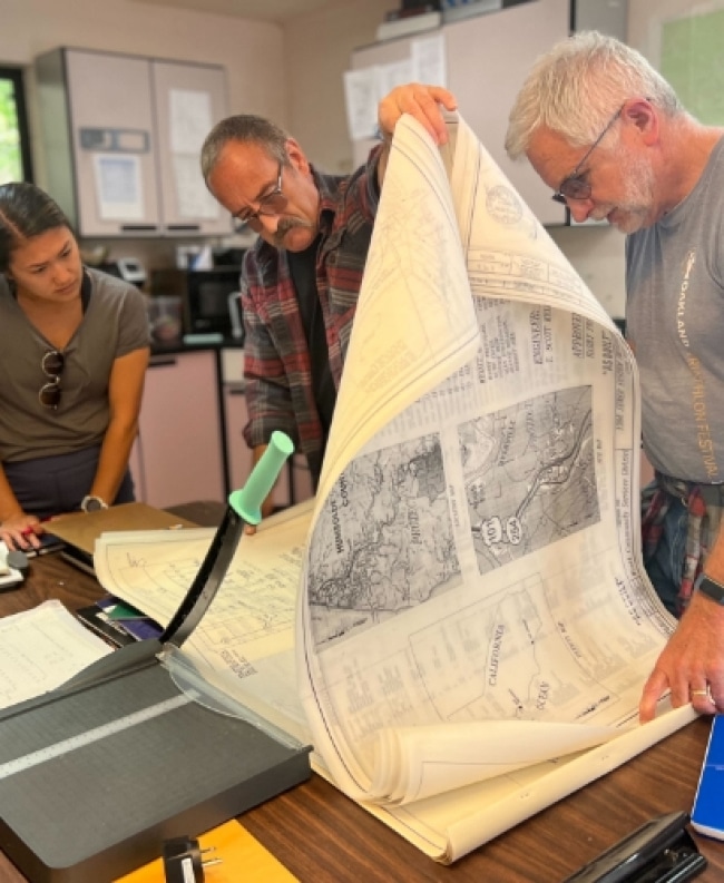 a person looking at a newspaper